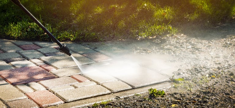 Dirty block pavement cleaning with high pressure washer