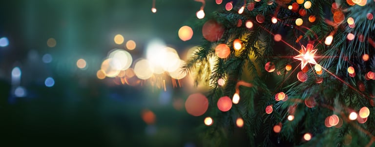 Christmas tree with bright star and illumination lights at evening