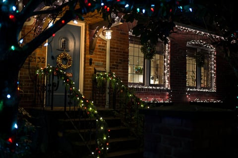 Christmas decorated home with colorful lights
