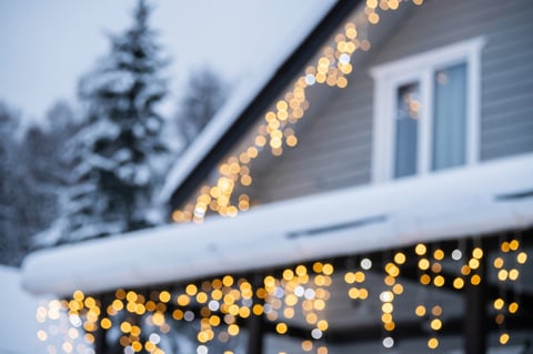 Winter house with festive Christmas lights