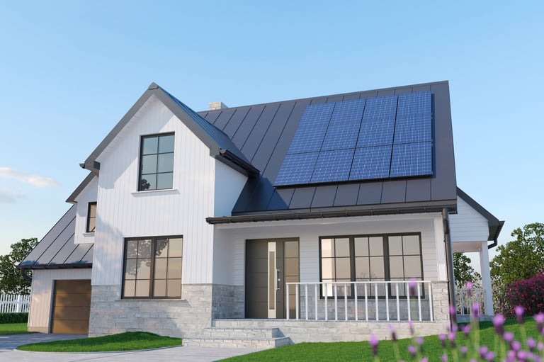 Modern single-family house with rooftop solar panels on a dark metal roof