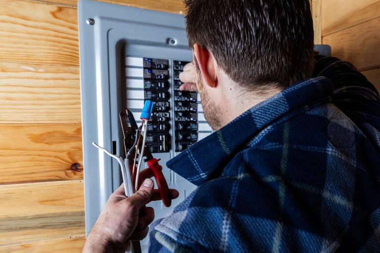 Electrician preparing electrical cables for installation