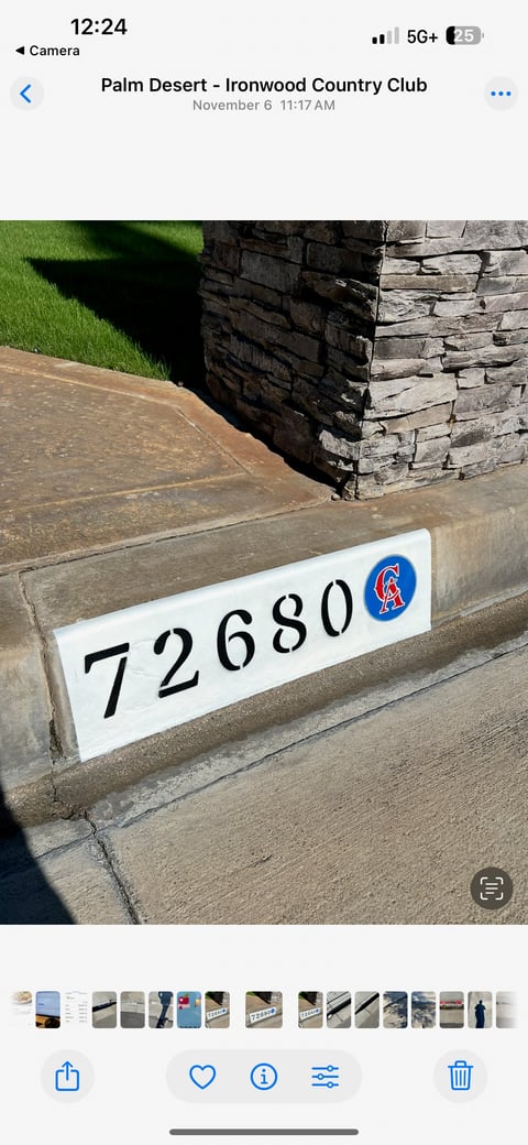 House address marker displaying 72680 with Chicago Cubs logo on stone driveway at Palm Desert country club