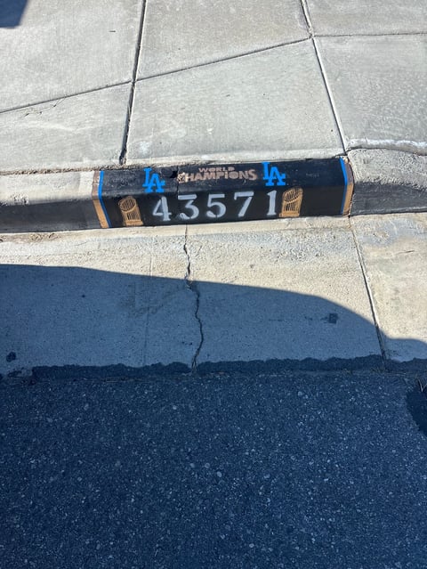 Los Angeles Dodgers champions wristband with number 43571 on concrete surface